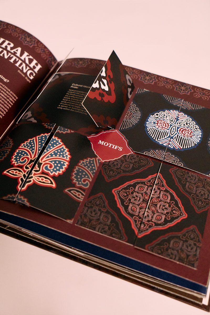 Beyond Preservation book, pop-up bell illustration in dark red