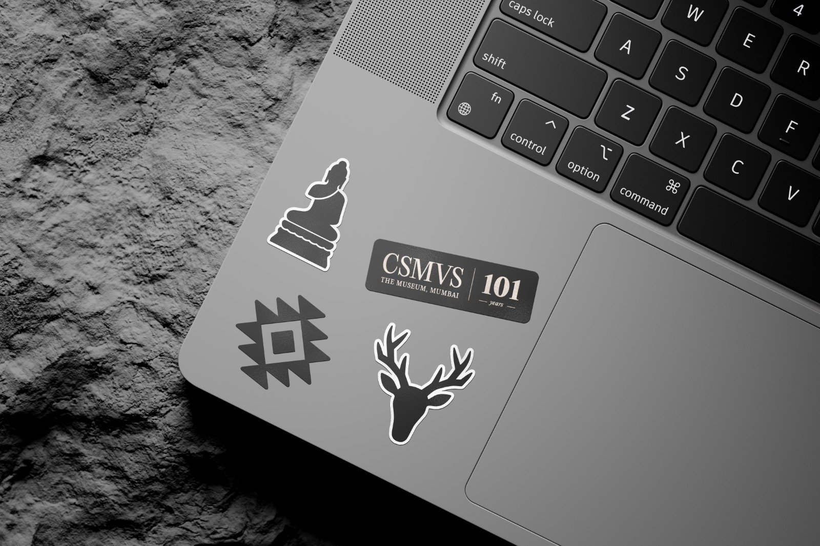 CSMVS motif stickers on a laptop